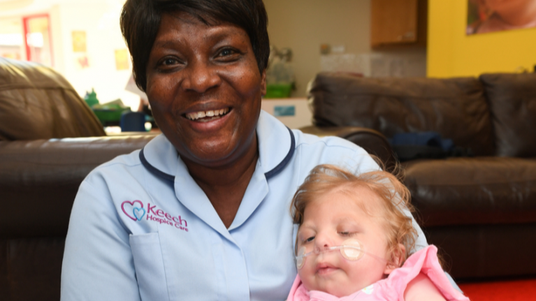 Hospice nurse with little girl